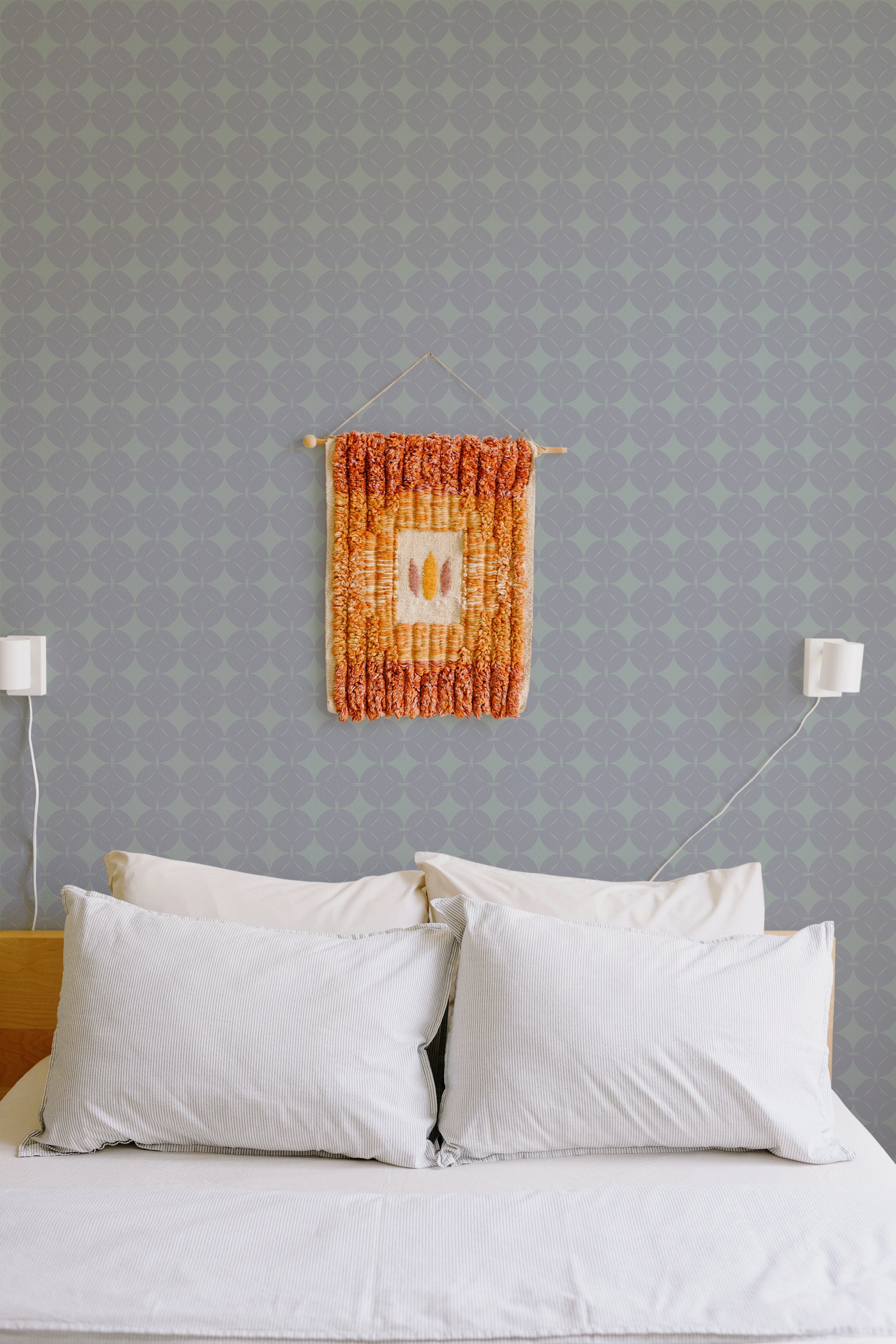 Self-adhesive wallpaper with a geometric Gemstone pattern in a soft grey hue, creating a subtle and modern look.