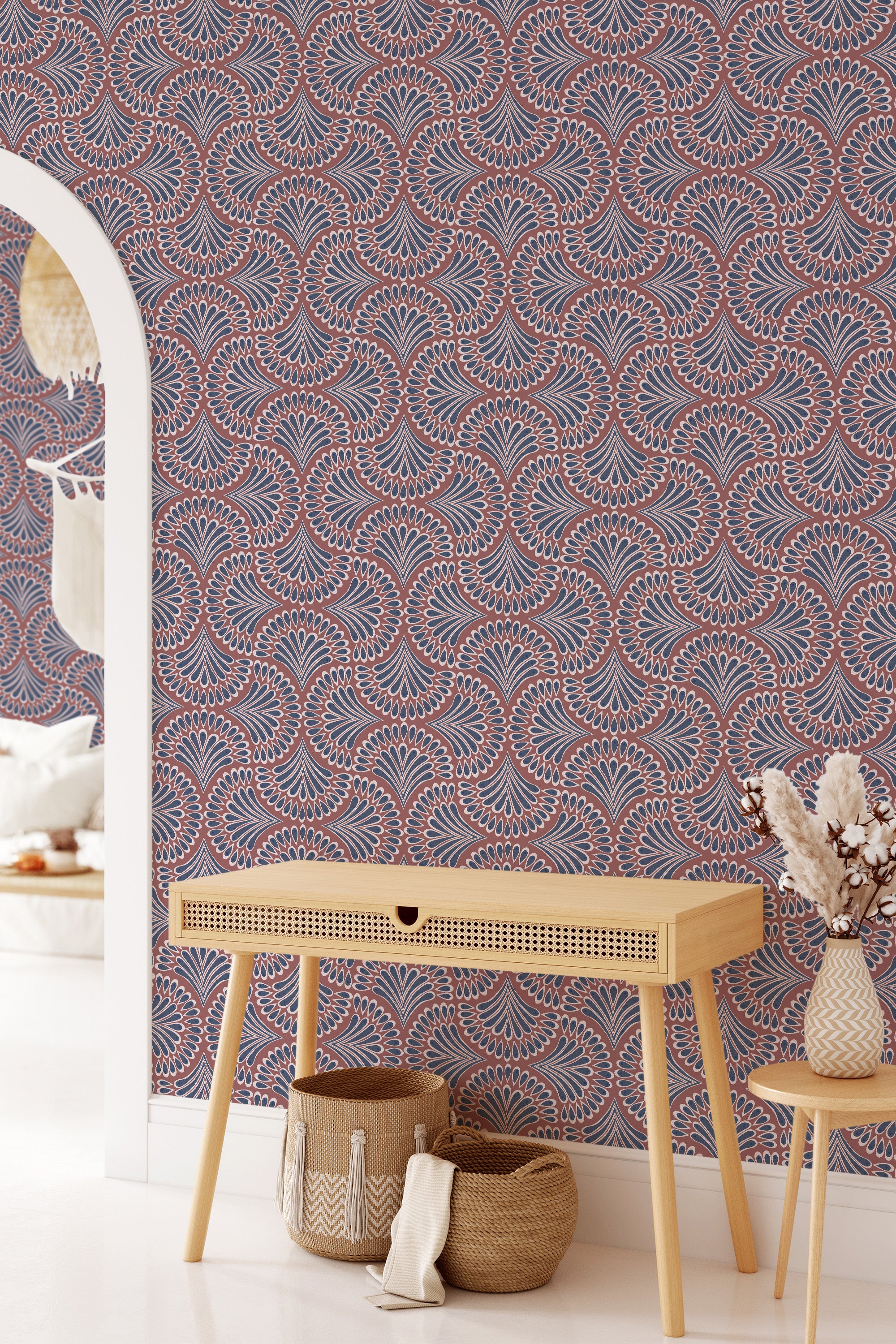 Paisley-patterned wallpaper in shades of red, white, and blue, creating an intricate and rhythmic design with floral motifs and teardrop shapes. Traditional wallpaper.