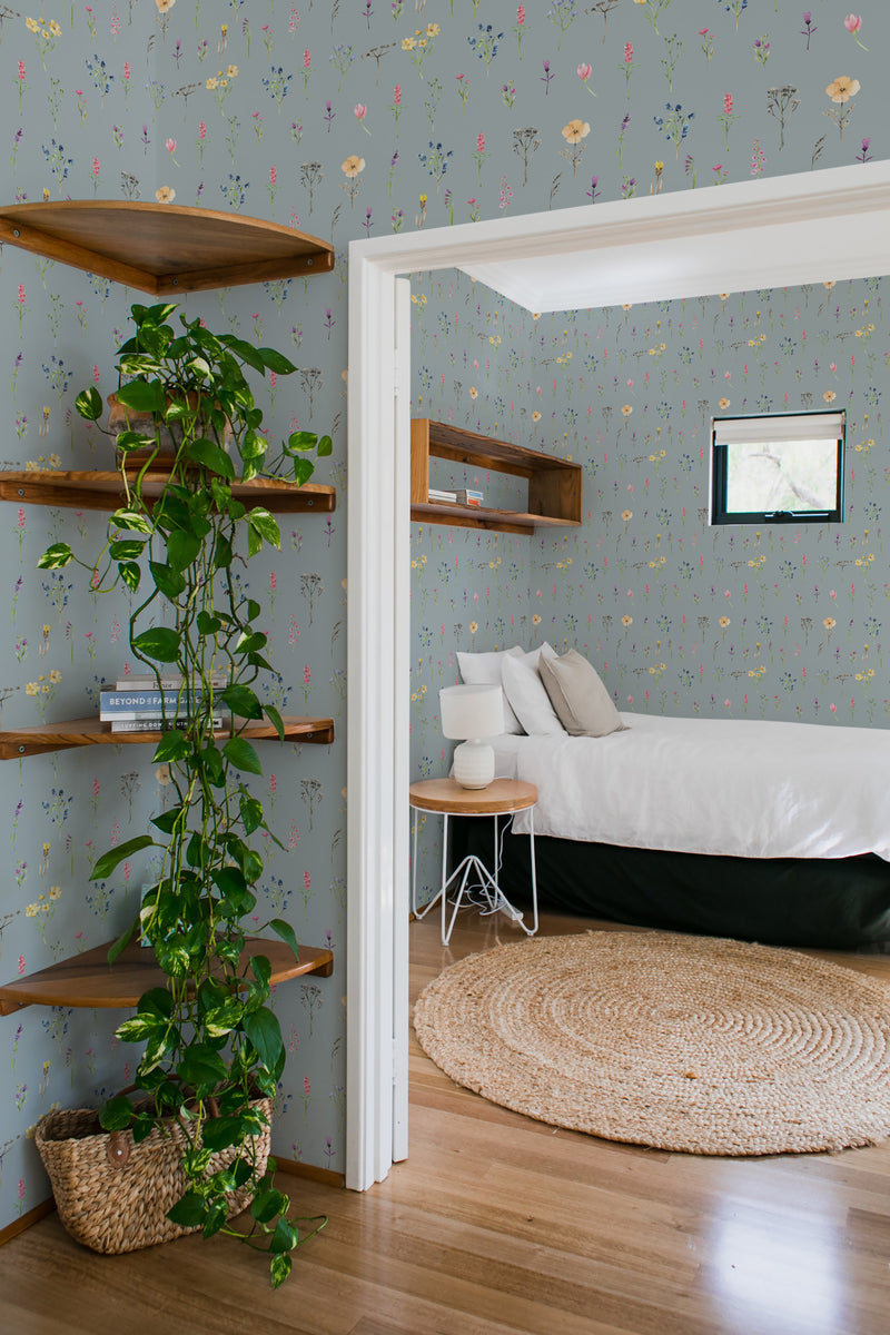 bedroom cozy interior green plants round carpet colorful wildflowers peel & stick wallpaper