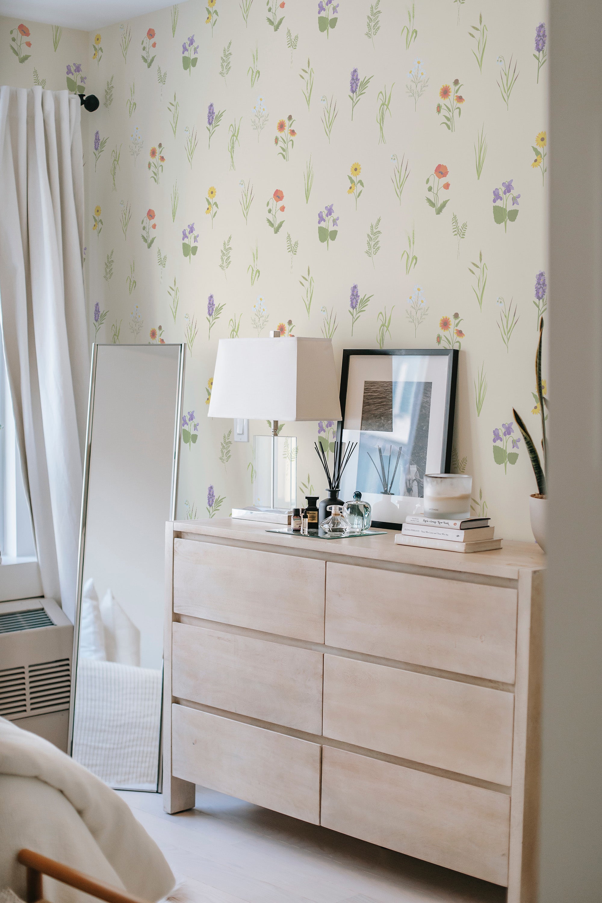 Floral wallpaper with soft, pastel-colored flowers and delicate green stems arranged on a light cream background, creating a serene and gentle atmosphere, traditional wallpaper.