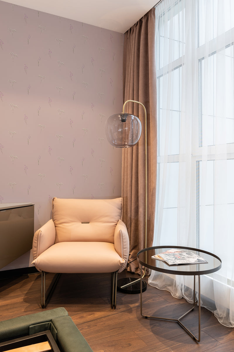 wallpaper stick and peel pink nursery meadow pattern modern armchair lamp table reading area