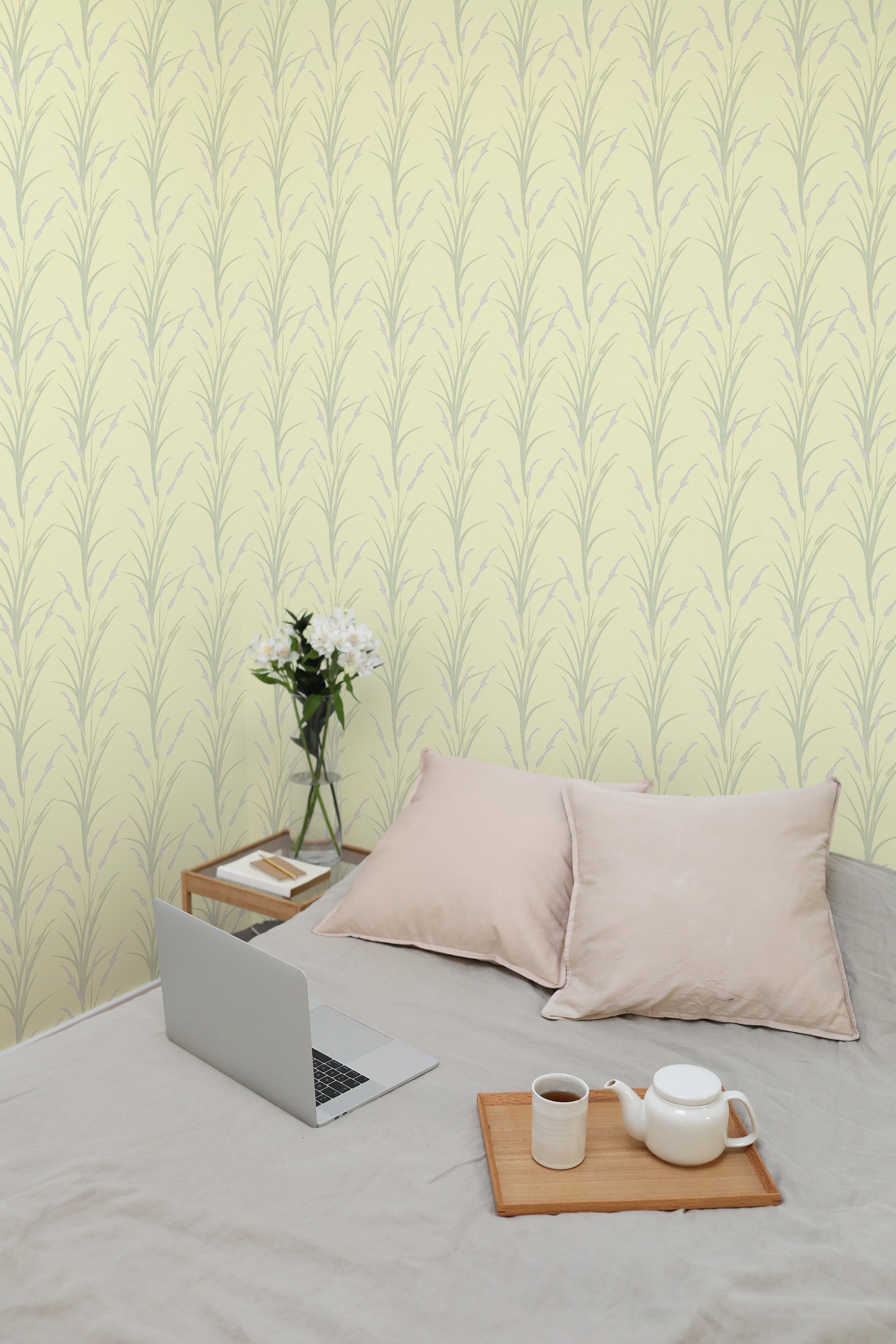 Self-adhesive wallpaper with a soothing yellow background and delicate lavender sprigs arranged in vertical rows, adding a calming and natural touch to the room.