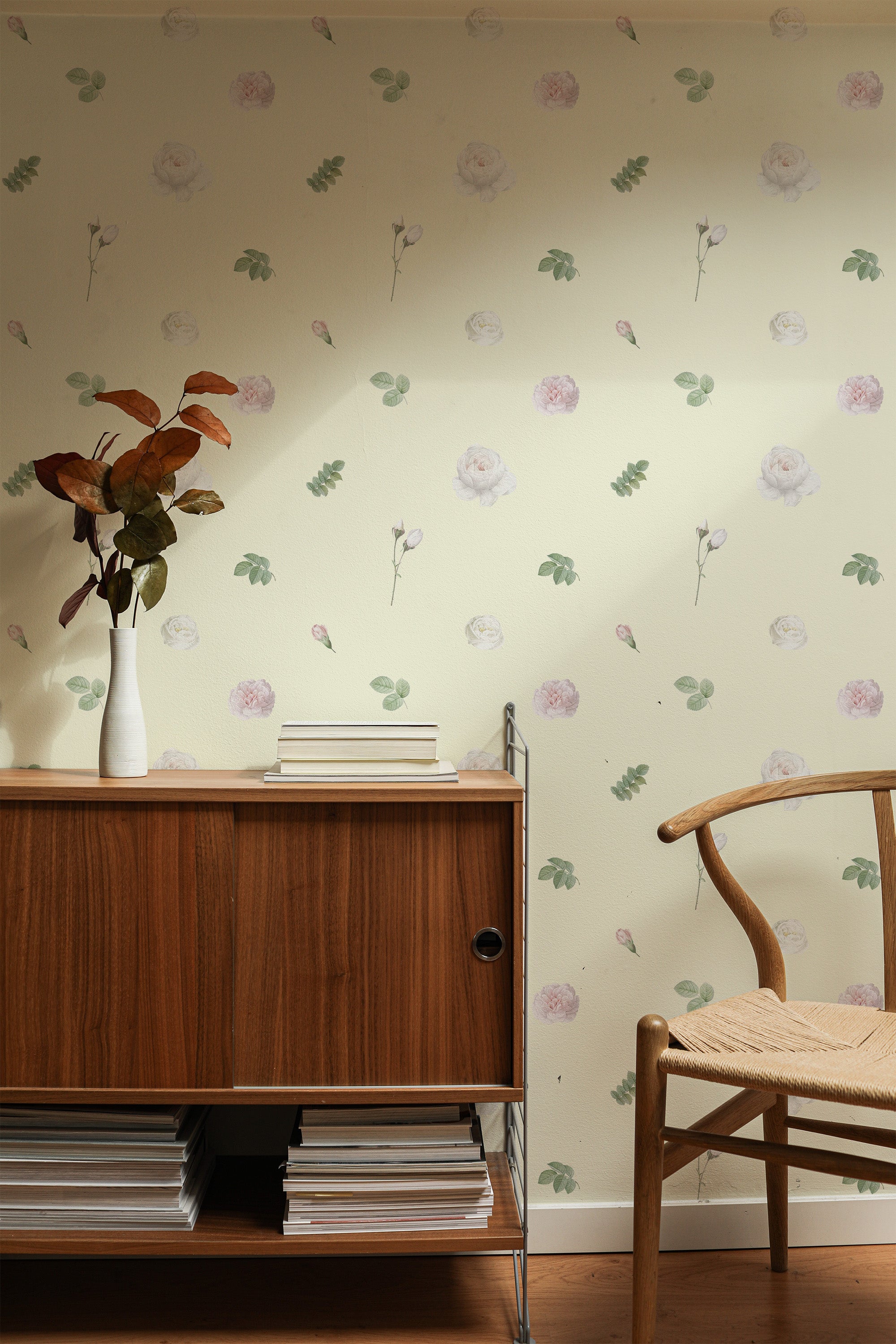 Self-adhesive wallpaper with a delicate watercolor blossoms design, featuring soft pastel flowers and green leaves scattered across a light cream background.