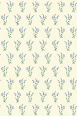 Lavender sprigs in soft purple with green stems and leaves repeat in a consistent, evenly spaced pattern on a light beige background. Peel and stick removable wallpaper.