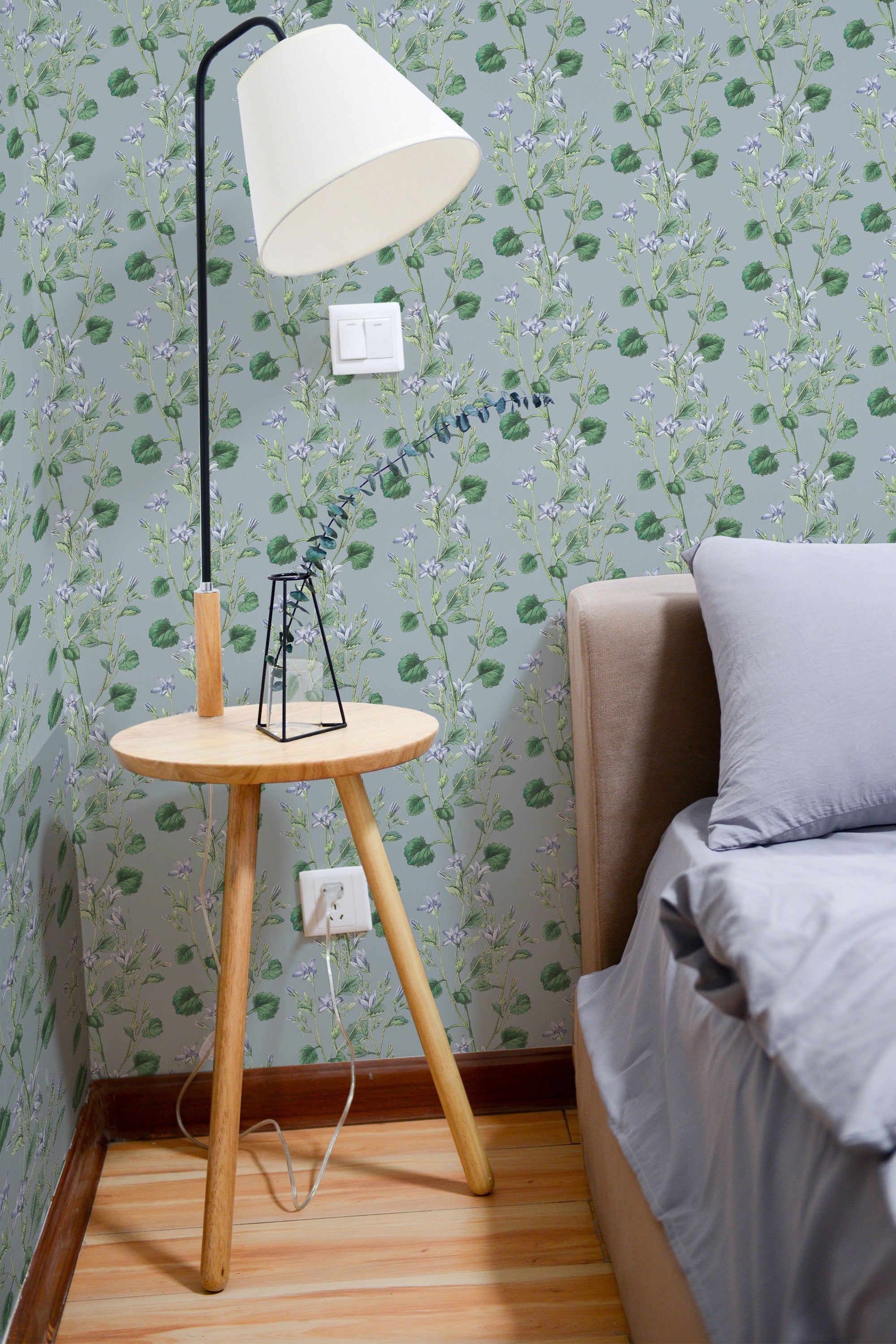 Self-adhesive wallpaper with a hand-drawn floral design featuring delicate flowers and intricate leaves in soft, natural tones, adding a touch of elegance to the room.