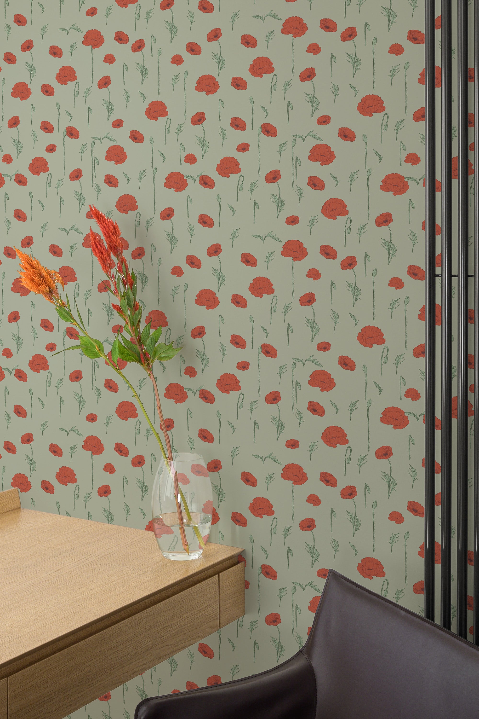 Self-adhesive wallpaper with a design inspired by a poppy meadow, featuring red poppy blossoms and green stems scattered across a muted greenish-beige background.