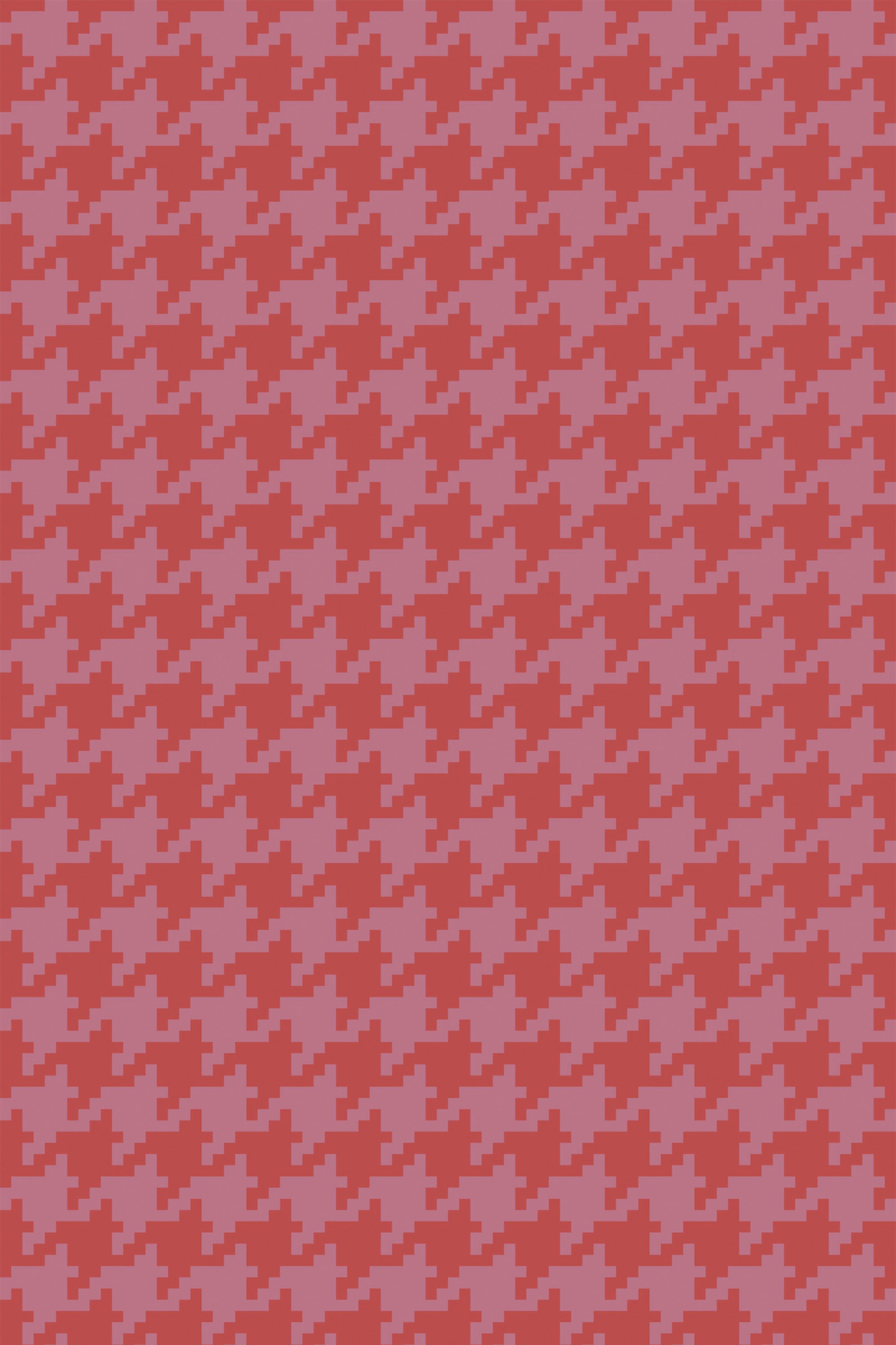 Red and pink houndstooth pattern with jagged, angular shapes repeating uniformly on a peel and stick removable wallpaper.