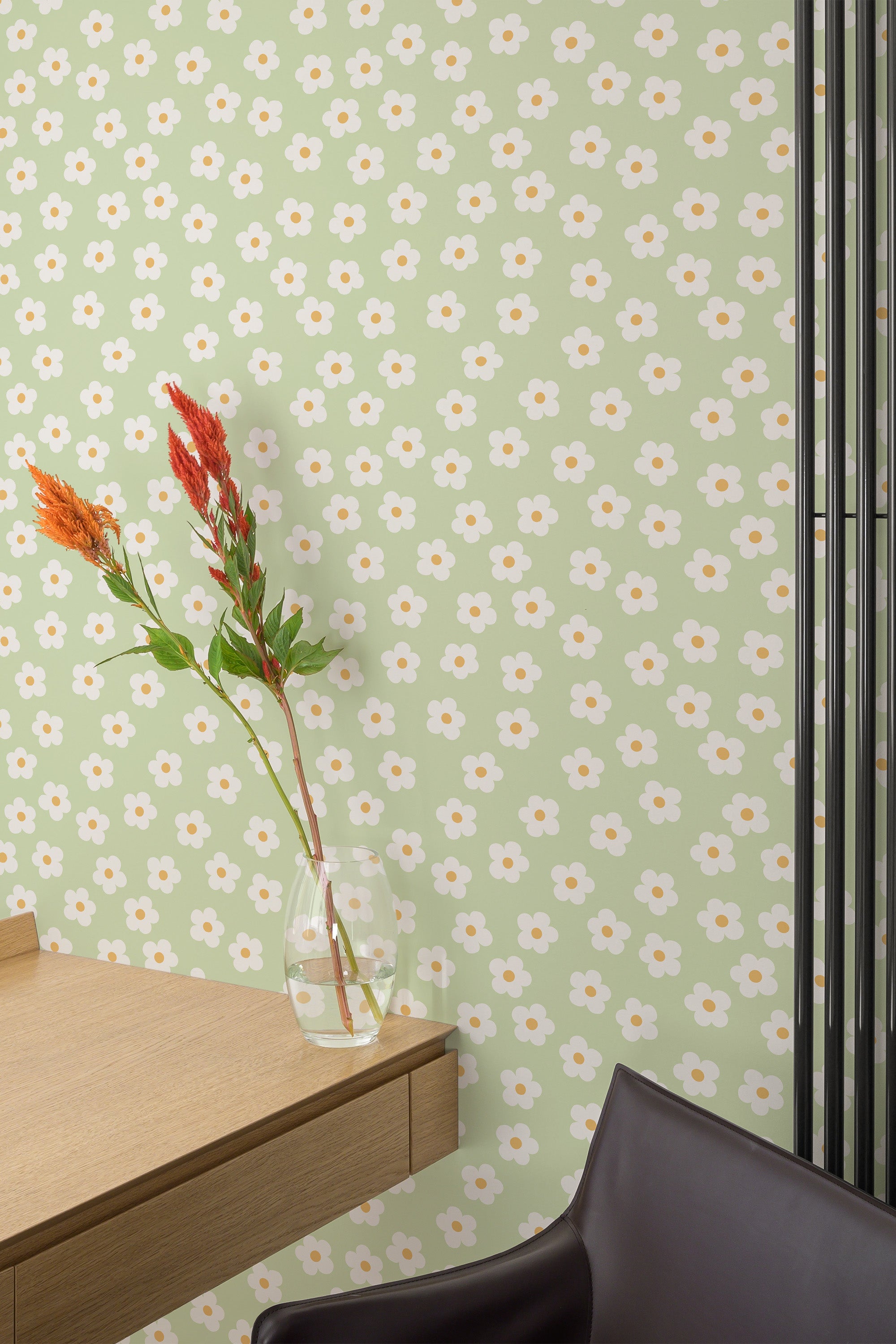 Self-adhesive wallpaper with a pattern of small white daisies on a light green background, adding a fresh and floral touch to the room decor.