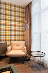 wallpaper stick and peel orange autumn plaid pattern modern armchair lamp table reading area