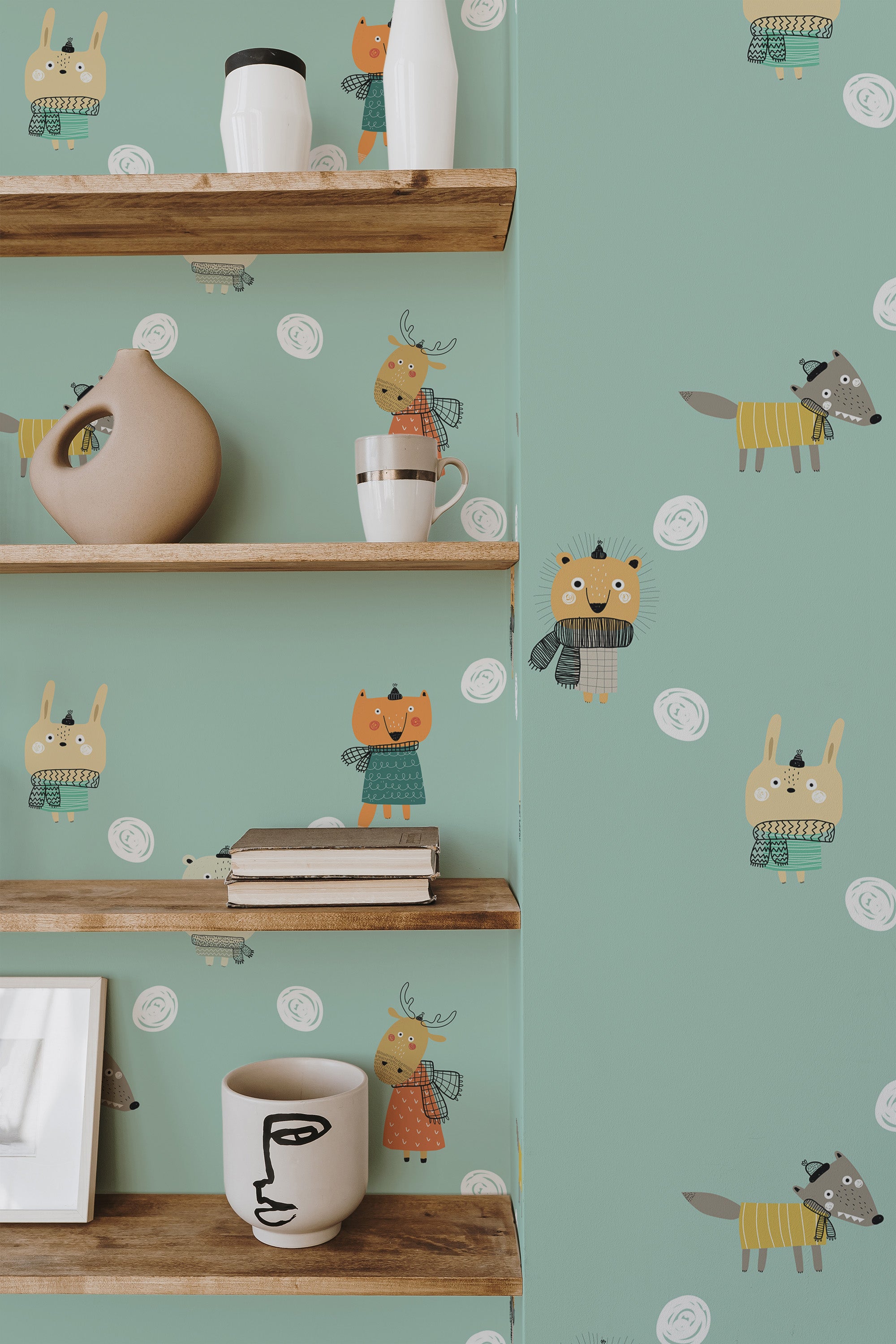 Self-adhesive wallpaper with illustrations of cute baby cartoon animals such as giraffes, lions, and owls in soft colors on a green background, adding a playful touch to the room's decor.