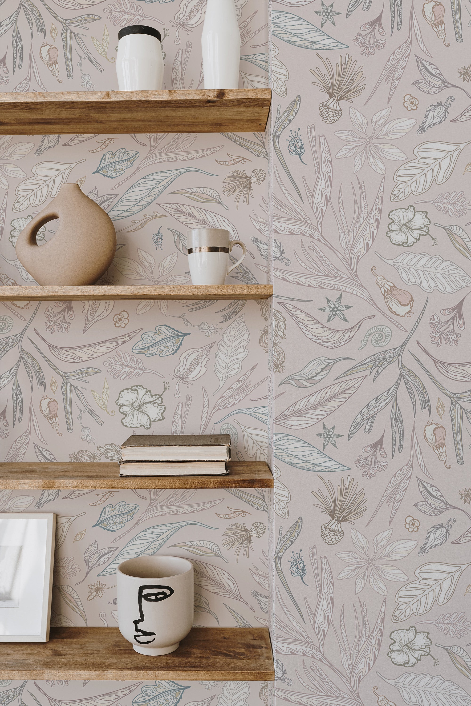 Self-adhesive wallpaper with illustrated greenery and fauna on a neutral background, with wooden shelves and decorative items on display.