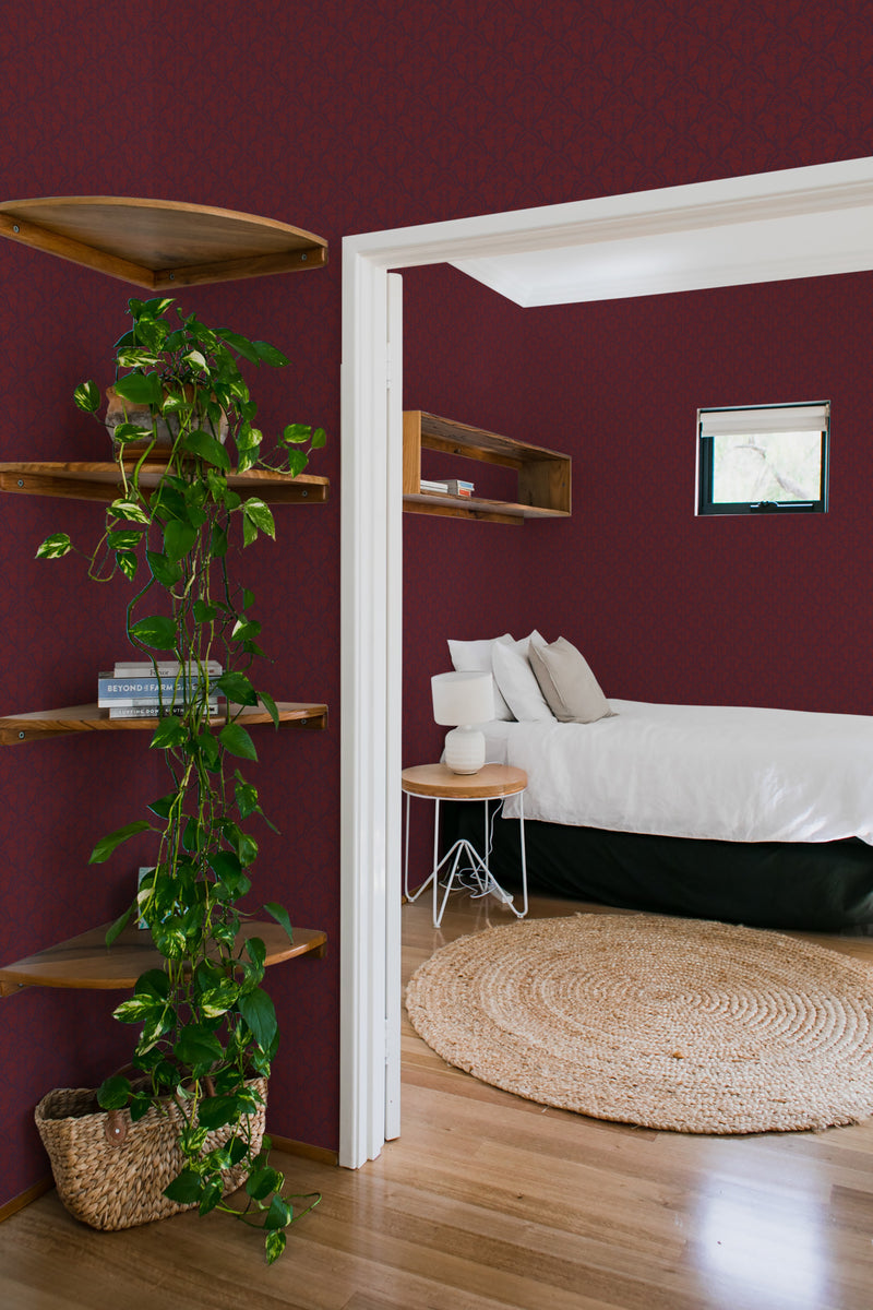 bedroom cozy interior green plants round carpet burgundy damask peel & stick wallpaper