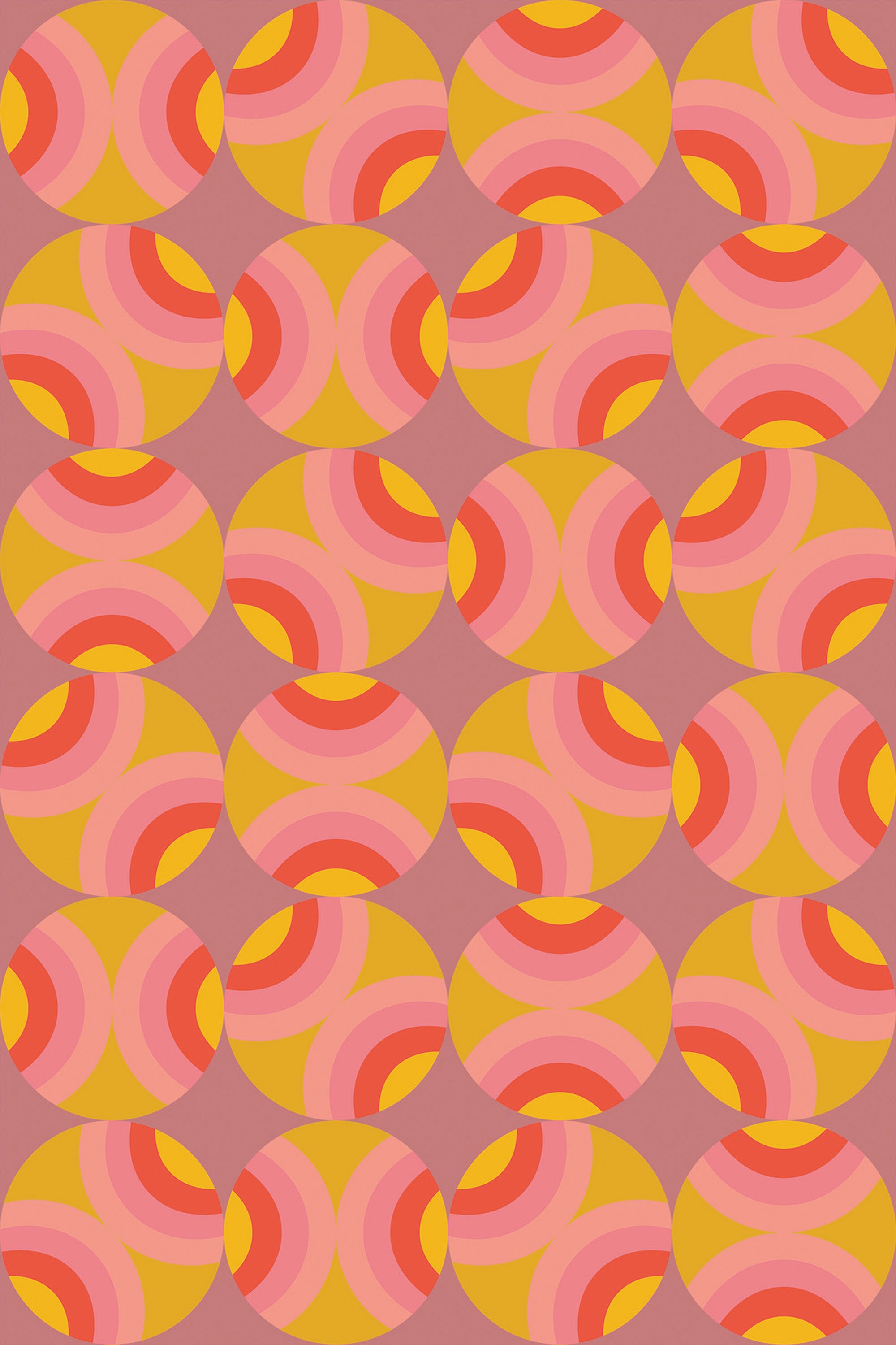 Colorful retro circles pattern in shades of pink and orange on a peel and stick removable wallpaper.