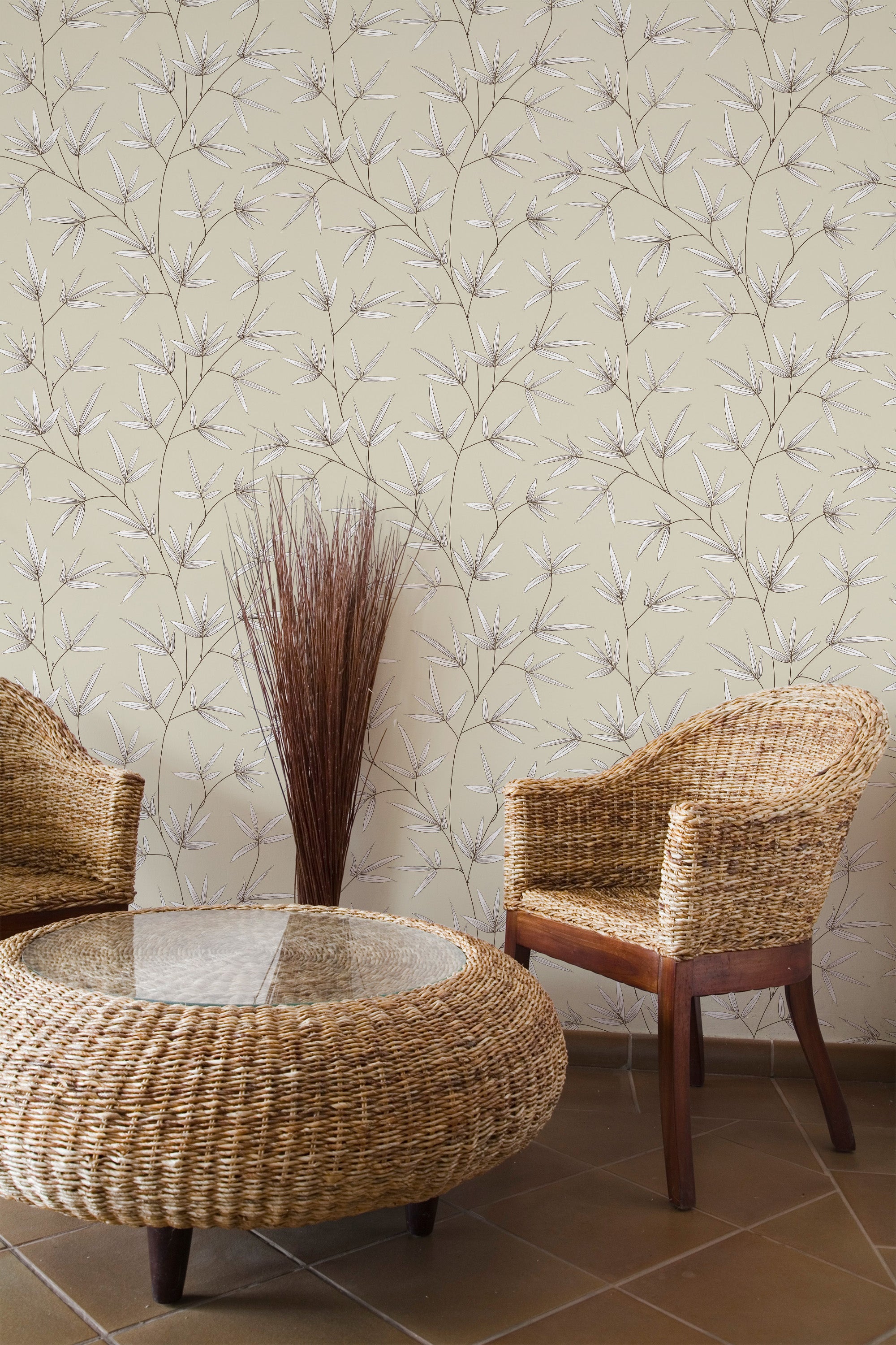 Self-adhesive wallpaper with a pattern of neutral-toned tree branches on a light background in a room with wicker furniture.