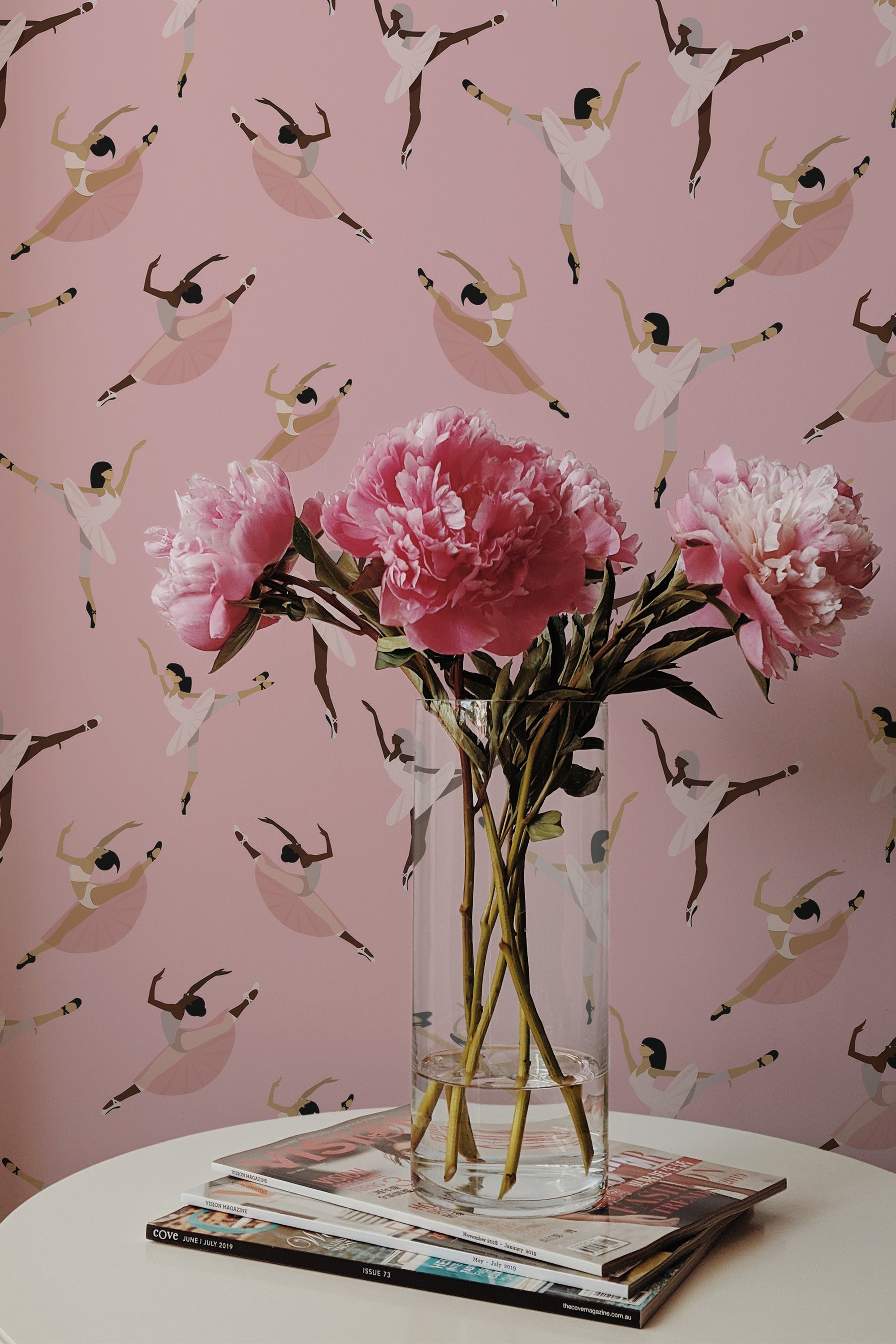 Self-adhesive wallpaper with a pink background and a pattern of ballerinas in different dance poses.