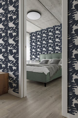 modern bedroom cushions concrete ceiling bold navy stroke accent wall