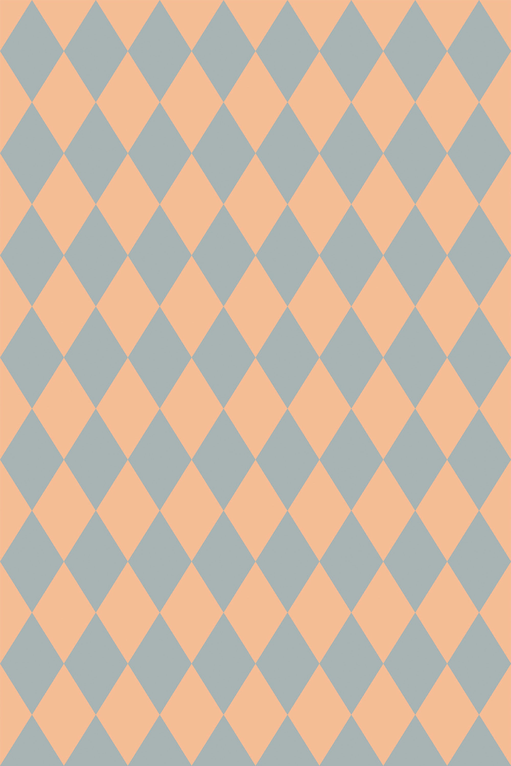 A pattern of peach and sage green diamond shapes in a harlequin design on peel and stick removable wallpaper.